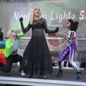 Woman and dancers performing on stage