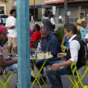 People playing chess at mural event