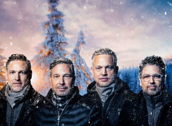 photo of the blenders guys in winter coats standing in a snowy forest