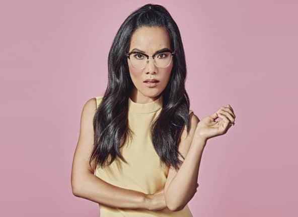 Ali Wong staring straight ahead on pink background