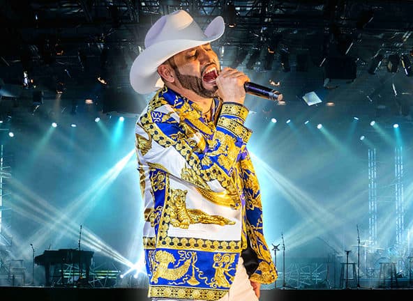 Pancho Barraza singing with cowboy hat