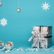 Photo of silver-wrapped gifts and ornaments