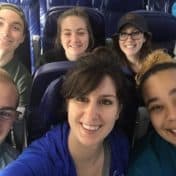 Ari Koehnen Sweeney and Vanessa Agnes with 2019 Triple Threat Broadway Experience winners on a Sun Country flight to New York