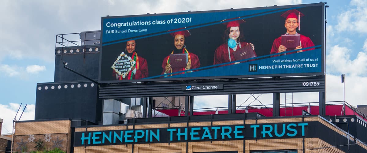 FAIR school graduates shine on a billboard