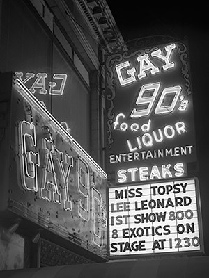Gay 90s neon signage and awning, featuring Miss Topsy, Lee Leonard.