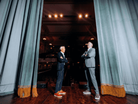 Tom Hoch (left) and Fred Krohn (right) stand on the stage of the State Theatre. Photo by Nemuel Sereti