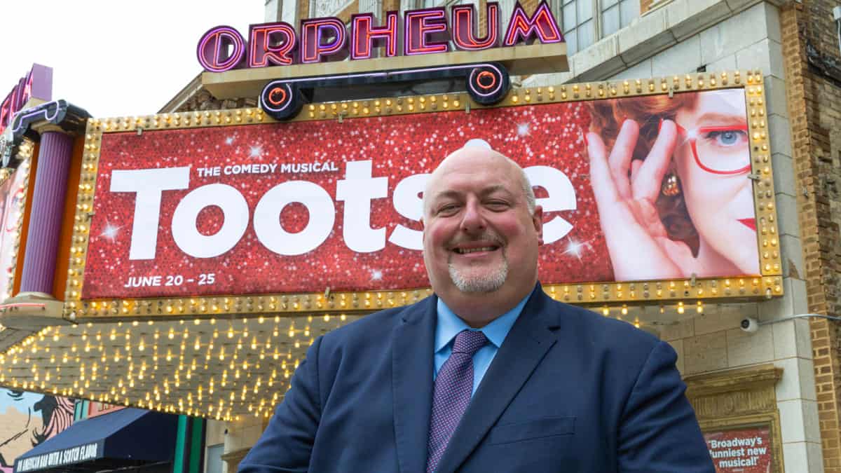 Hennepin Theatre Trust CEO Todd Duesing in front of the Orpheum Theatre Marquee