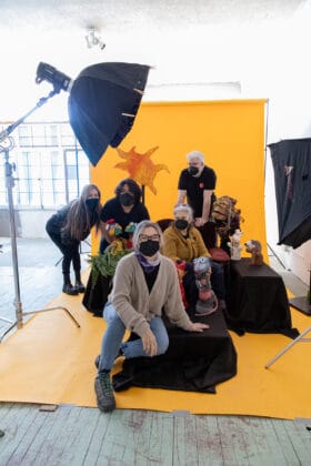 Artist, Kristine Heykants, poses with Z Puppets crew.