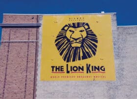 The Lion King banner hangs on the side of the Orpheum Theatre in Minneapolis, MN