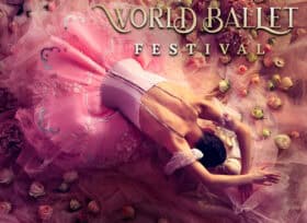top-view photo of a dancer bowing to the ground with their arms above their heads amidst a swirling background of pink colors. The text World Ballet Festival appears in the upper-right corner in gold lettering.