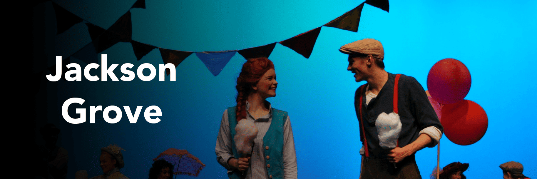 Jackson Grove, acting on stage with a woman, holding cotton candy and smiling. Jackson Grove name overlayed on image with black gradient on left side.